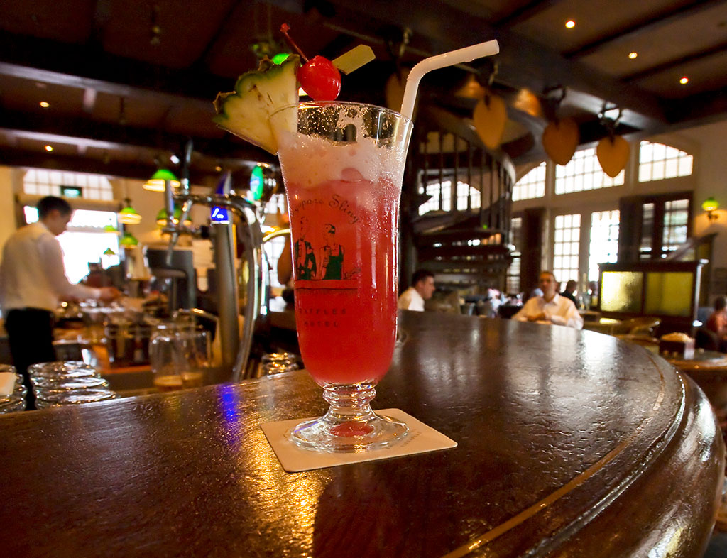 Singapore Sling on the bar at the Raffles Hotel