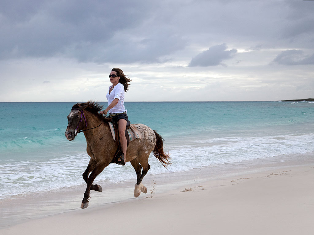 Visitors to Anguilla island have a variety of outdoor activities to choose from, including horseback riding along the beach
