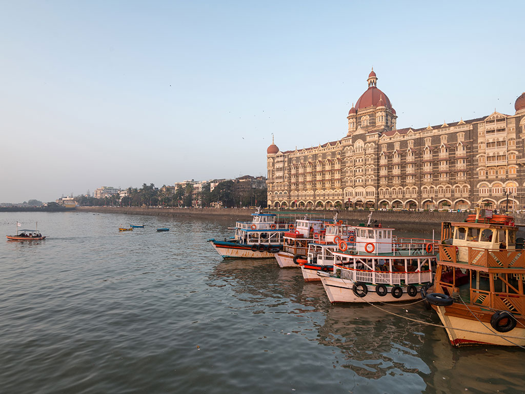 Boats in Mumbai harbor, with Taj Mahal hotel in the background