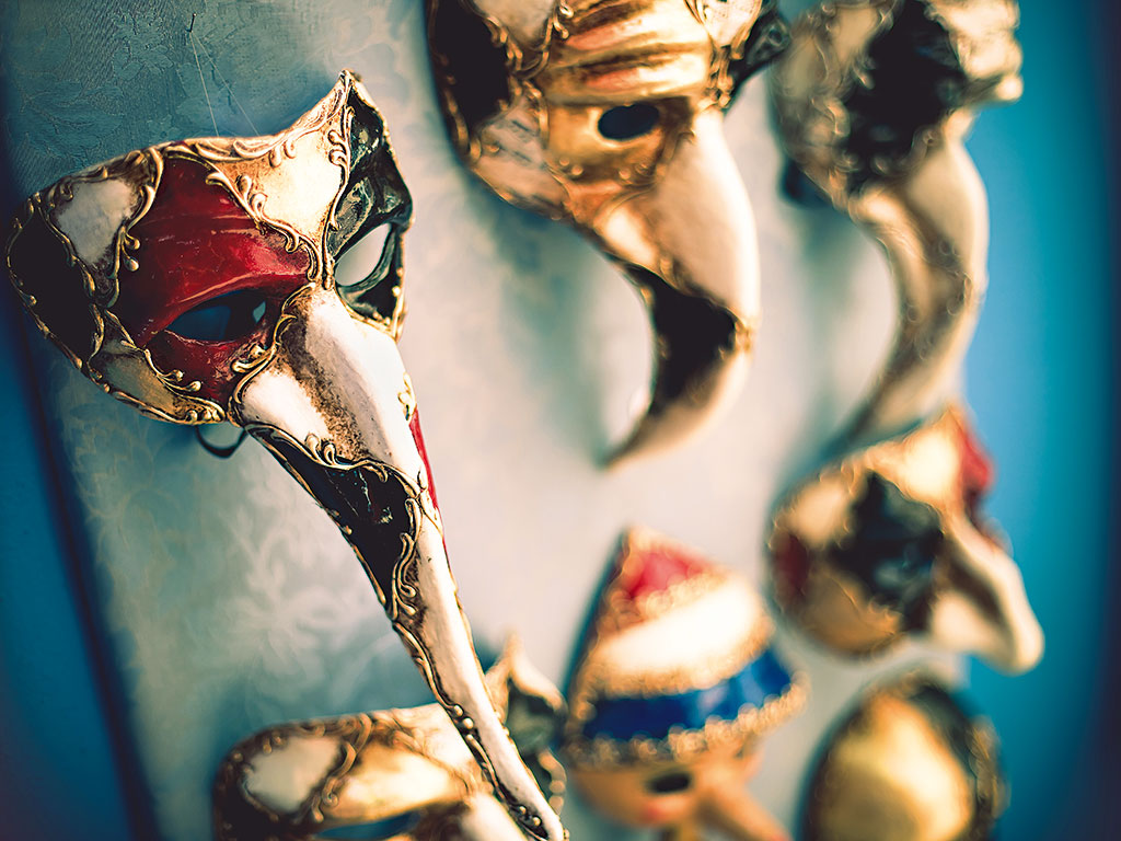 Venetian masks on display. Carnevale takes place at the beginning of the year and is famed elaborate masks and costumes