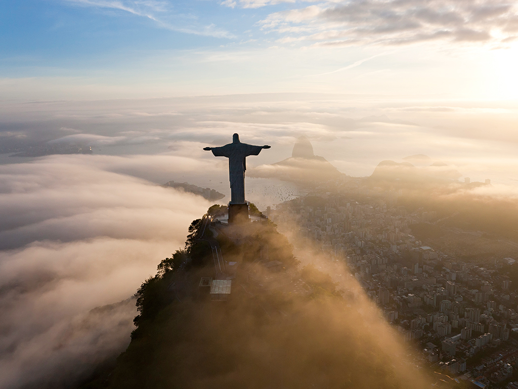 An aerial view of Christ the Redeemer, Rio de Janeiro. Brazil hosts a whole range of exciting destinations to visit, including the city of Recife and fishing village Trancoso