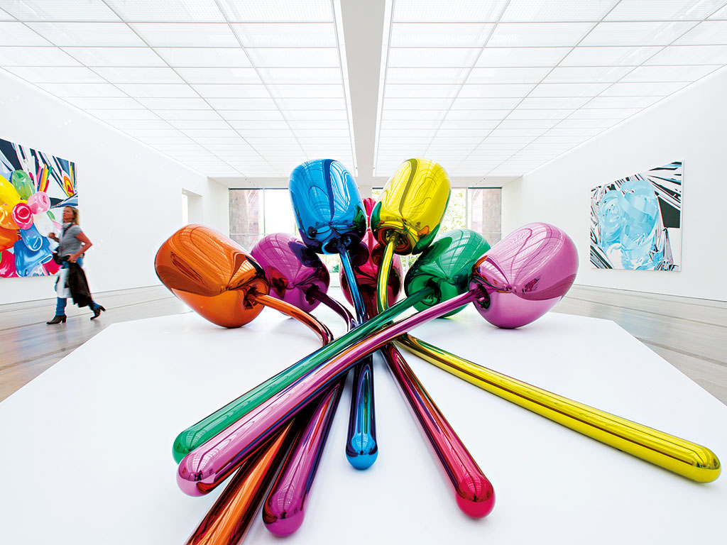 Jeff Koons' Tulips exhibited in Basel. The artist formerly worked as a Wall Street commodities broker, which many think has helped him make money in the art world