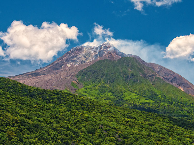 The Soufrière Hills volcano erupted in 1997, burying Montserrat's capital city in ash. The volcano is now a popular tourist attraction.